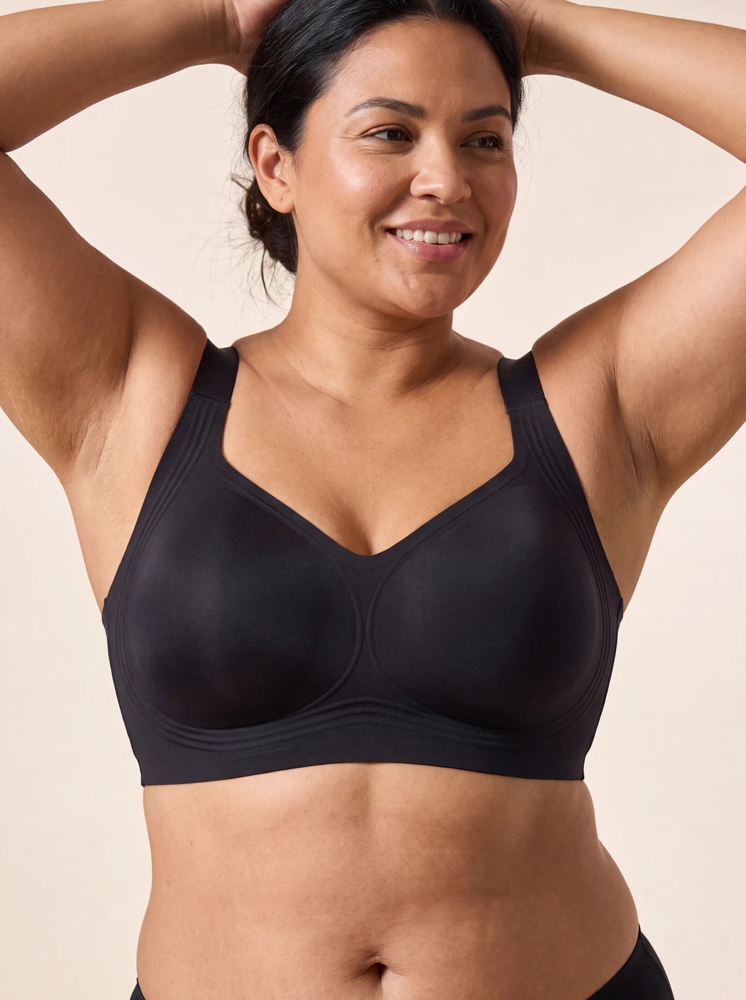 Black on model, arms up: cups stay in place