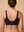 Black on model, back view: V-panels and 3-column hook closure