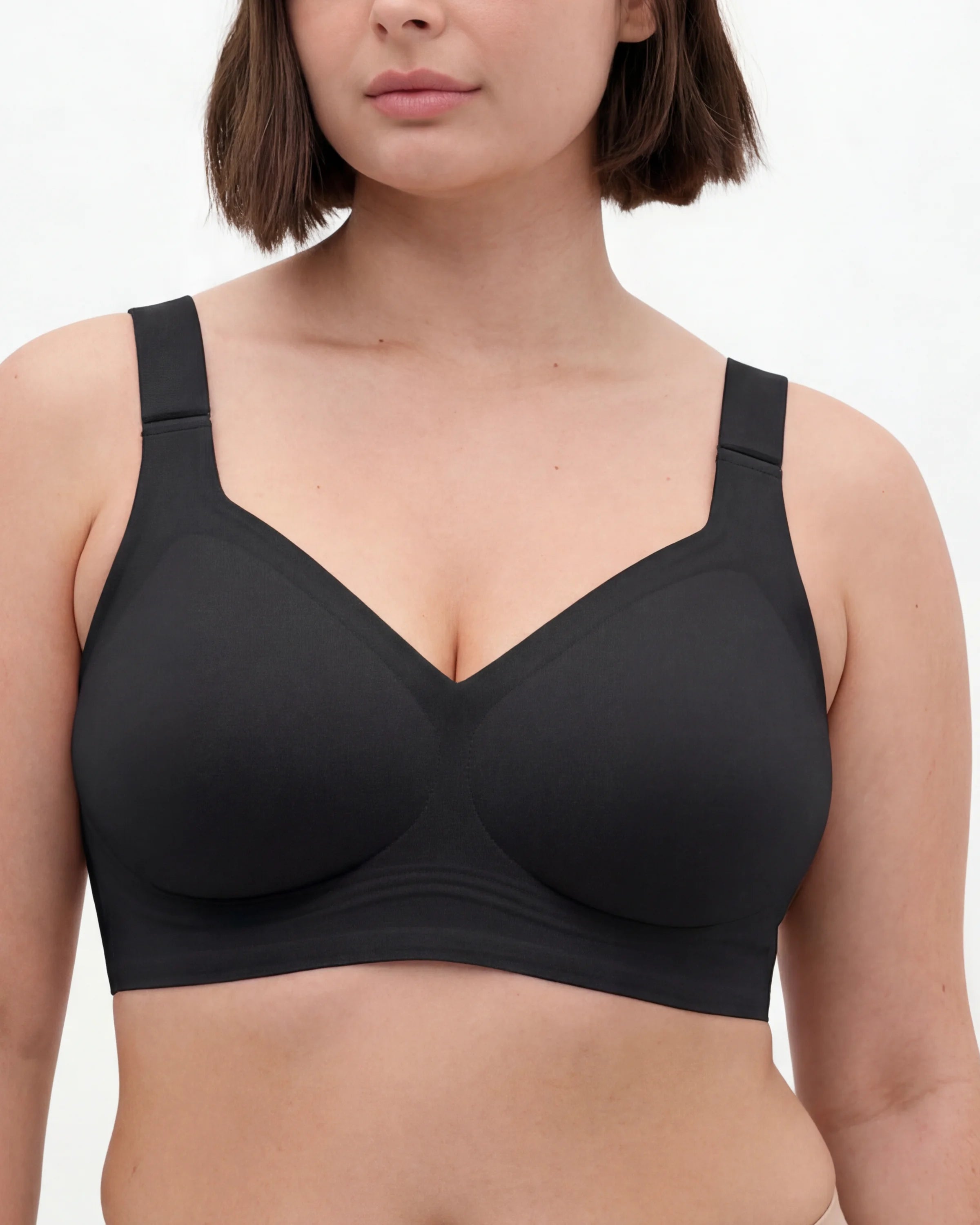 Full-bust woman wearing the SHEFORMA full-cover bra in black